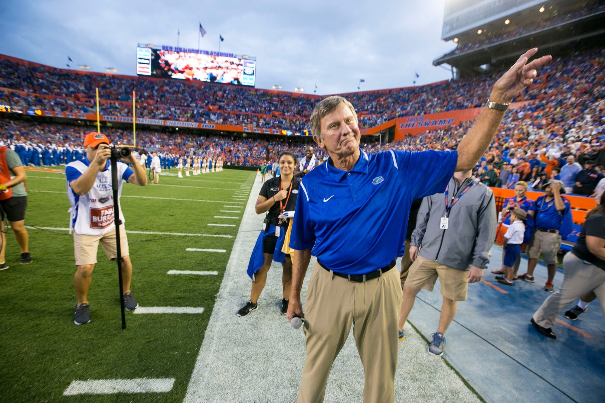Steve Spurrier waves toward Ben Hill Griffin Stadium during a game in 2016, the same year Florida Field added his name.