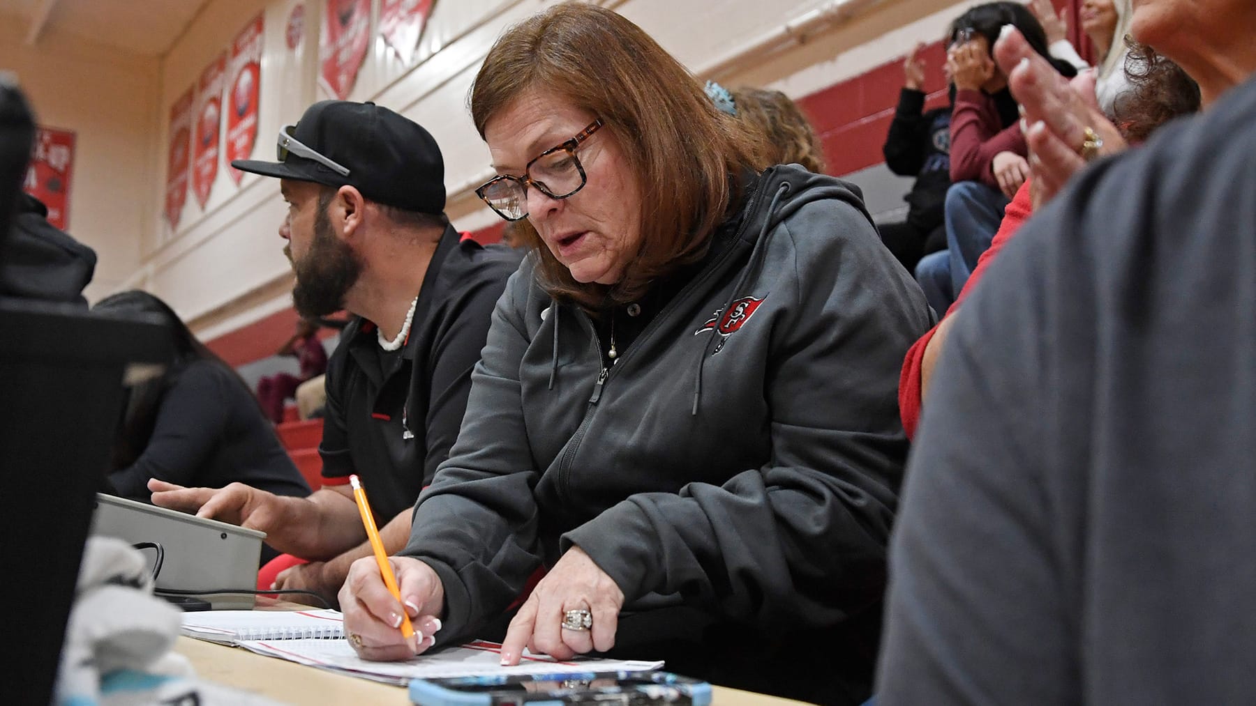 Angie King Thomas records a stat as the Santa Fe Raiders face Buchholz Thursday, Dec. 4, 2025, at Santa Fe High School in Alachua, Florida.