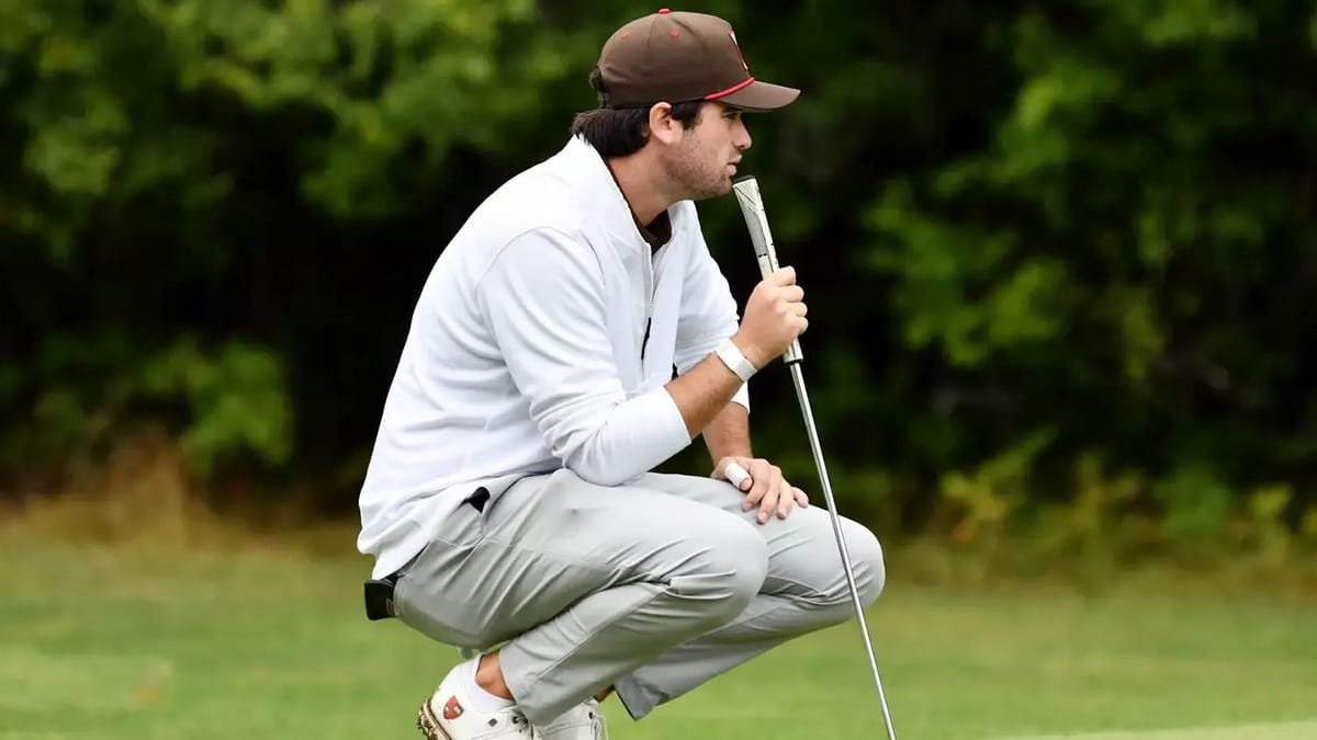 St. Lawrence men's golfer Jimmy King observes a green before putting during a tournament in Canton in 2025.