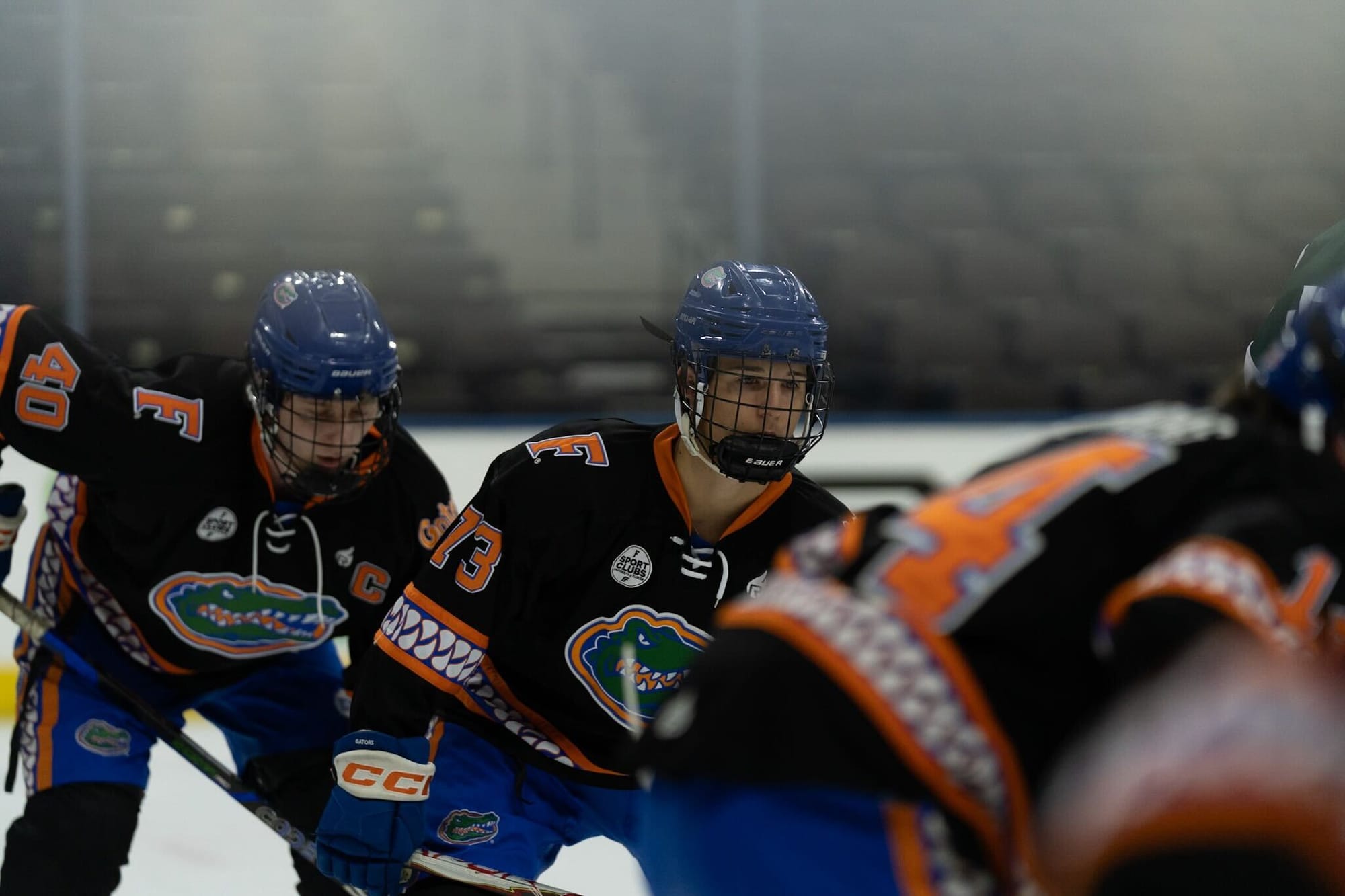 Florida club hockey players practice on the ice. 