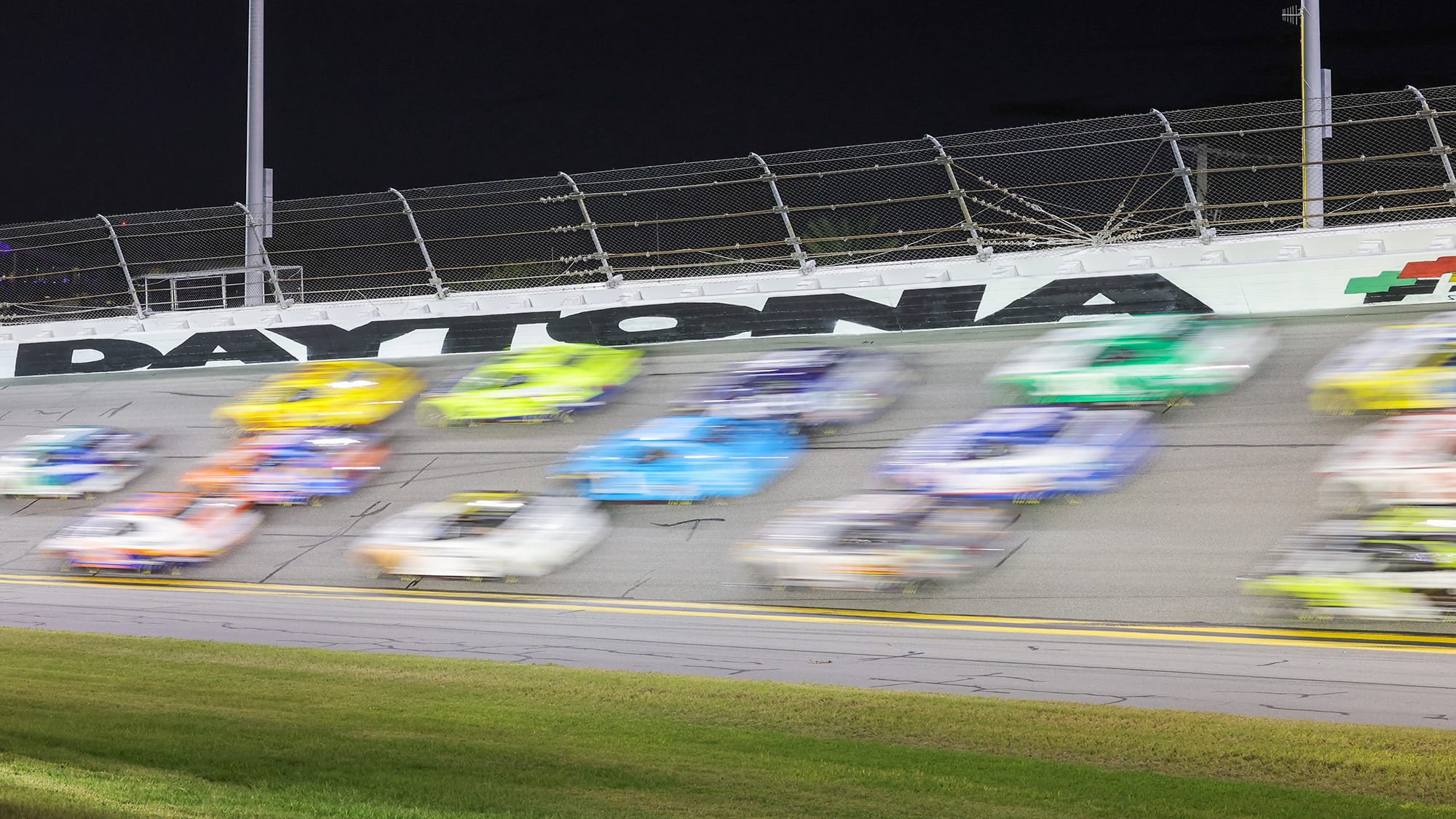 General view of blurred cars heading into turn four during the Coke 400 at Daytona International Speedway on Aug 24, 2024 in Daytona Beach, Florida. 