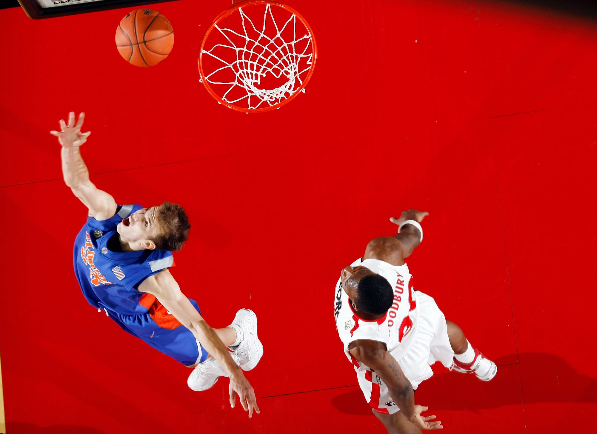 Florida Gators guard (33) Nick Calathes scores a basket in front of Georgia Bulldogs forward (30) Terrance Woodbury in the second half at Stegeman Coliseum on Feb. 27, 2008.