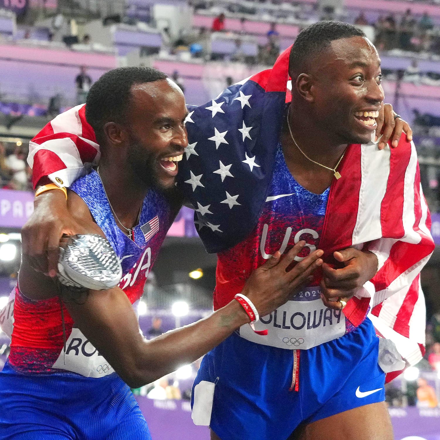 Grant Holloway (USA) celebrates with Daniel Roberts (USA) after placing first and second in the 110-meter hurdles final during the Paris 2024 Olympic Summer Games at Stade de France on Aug. 8, 2024, in Saint-Denis, France.